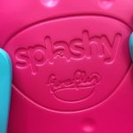 Close up of splashy firefly logo imprinted in the seat back